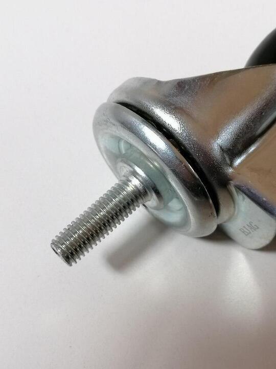 Castor and wheel for the sweeper