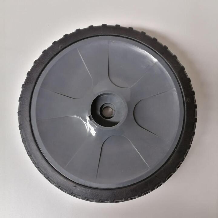 Rear wheel for floor sweeper