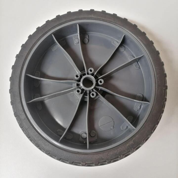 Rear wheel for floor sweeper