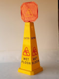 Wet floor sign yellow triangular cone