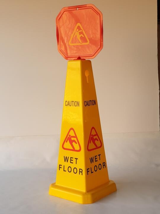 Wet floor sign yellow triangular cone