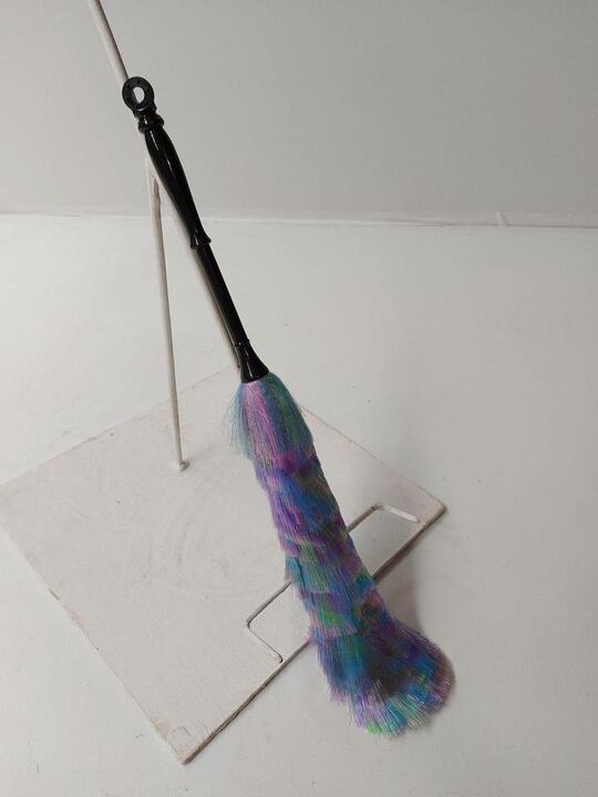 Duster with a black handle