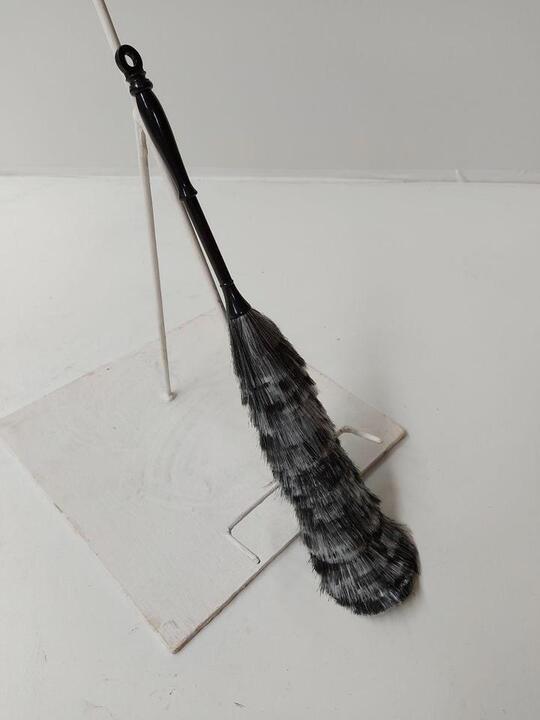 Duster with a black handle