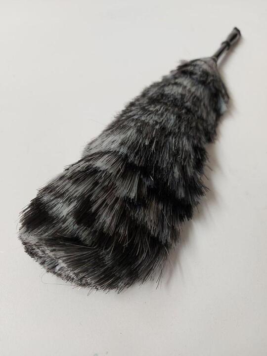 Duster with a black handle